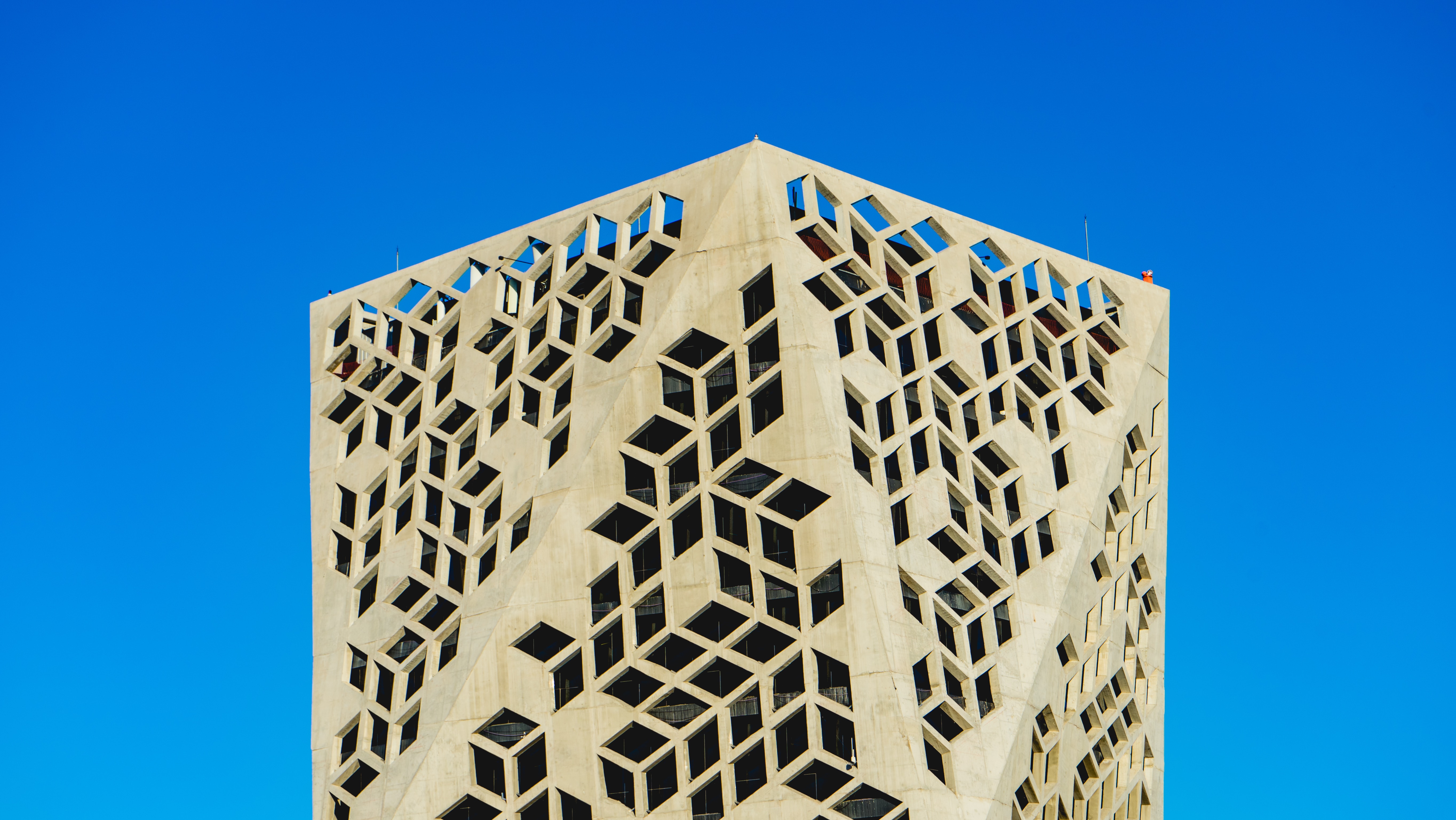 A tall building adorned with intricate geometric designs.