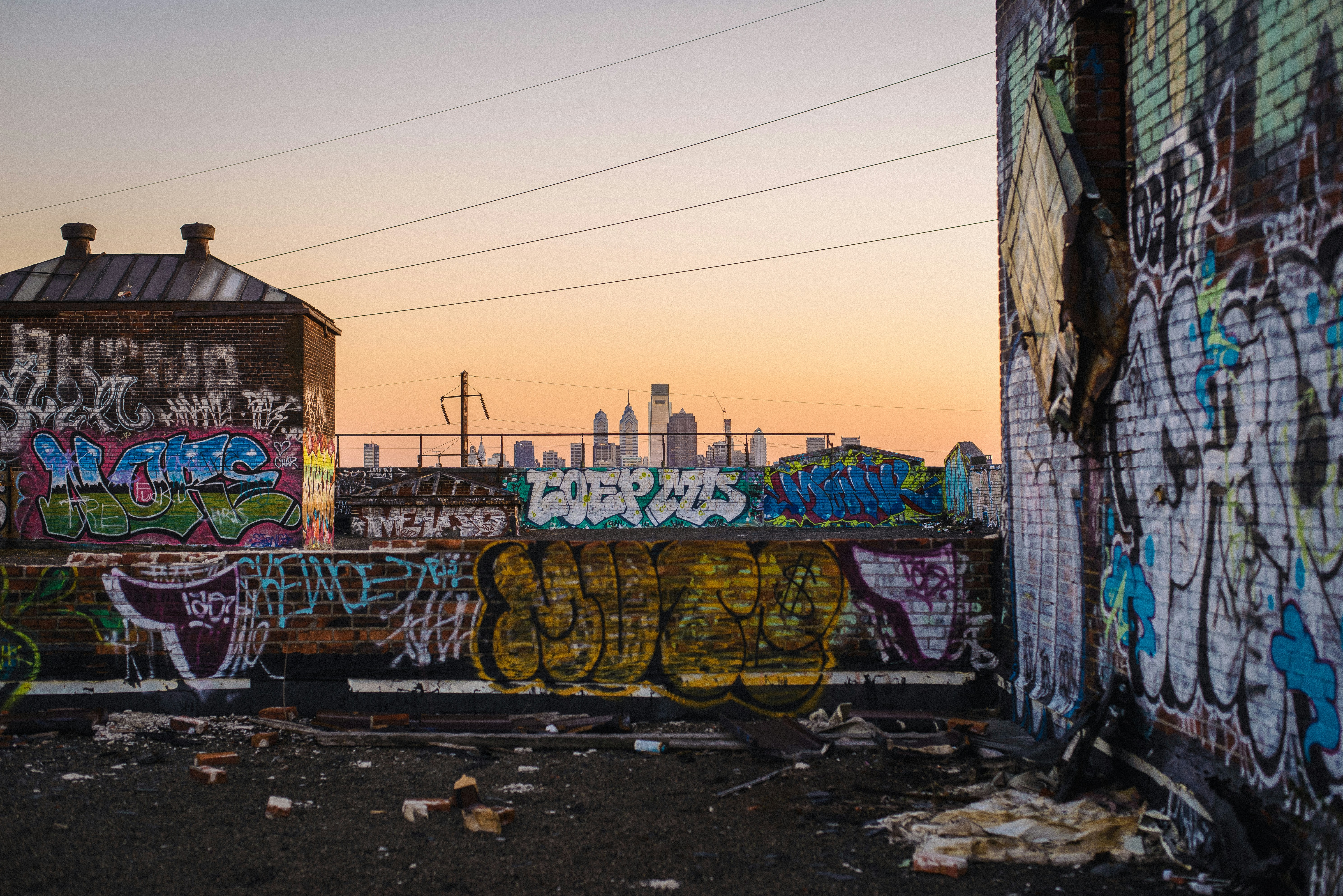 Art street in walls in New York. The sky is orange.